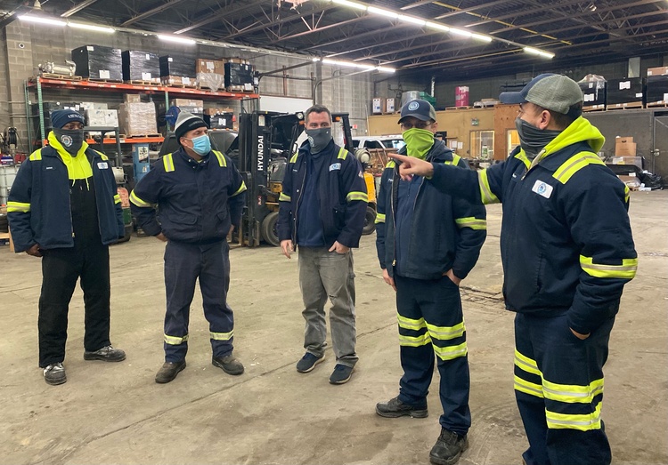 image of 5 A Royal Flush employees in company uniform wearing masks